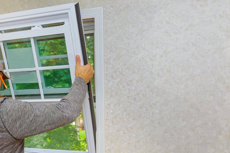 Worker in the installing new windows in a house for home renovation living energy efficiency