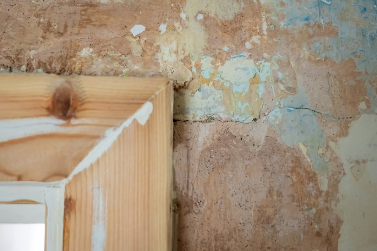 sanded wooden door casing closeup during home renovation.